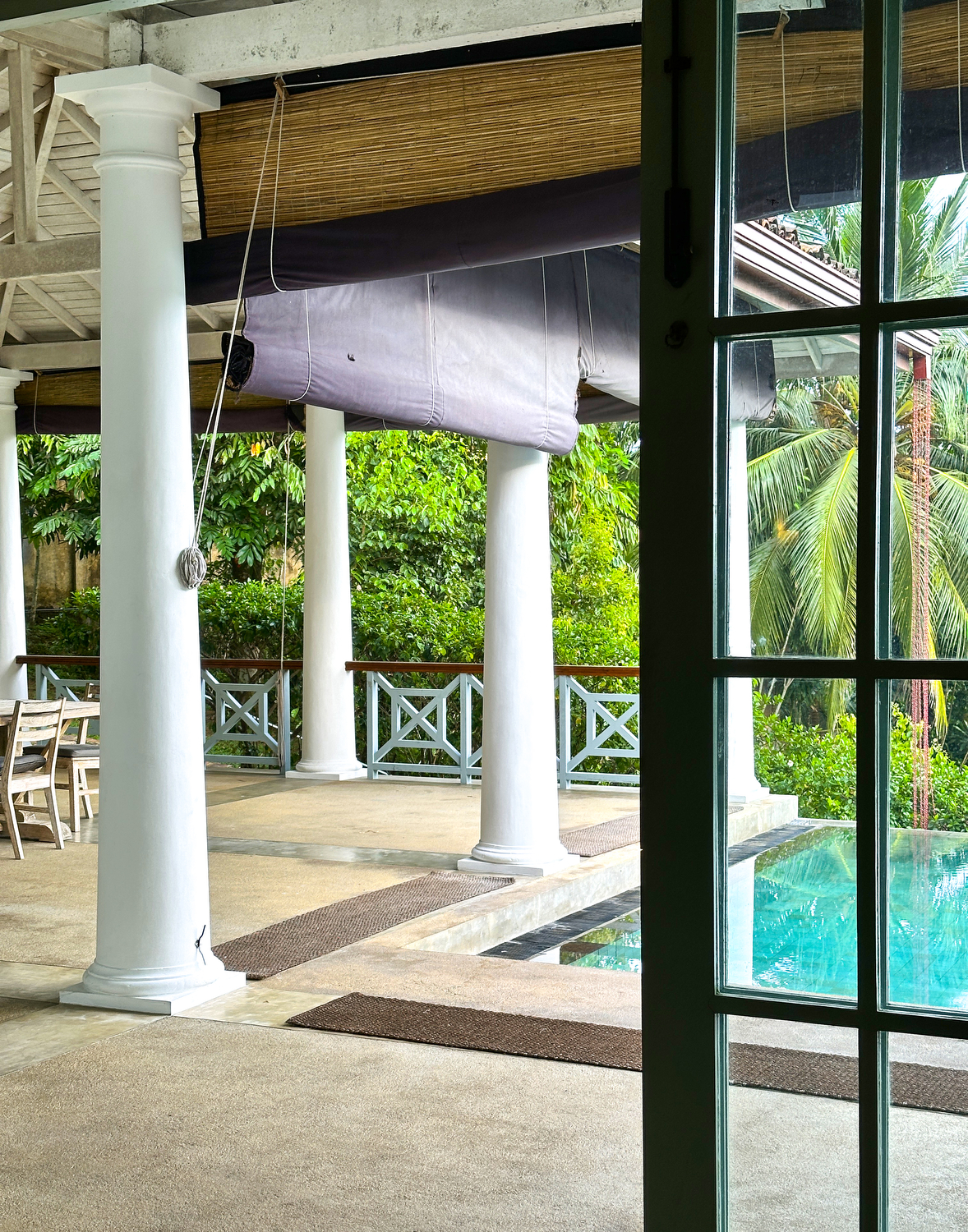 The verandah at Cassia Hill Villa, opening to greenery.